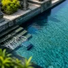 Piscine en pierre de Bali : robots de nettoyage haut de gamme pour un bassin d’exception